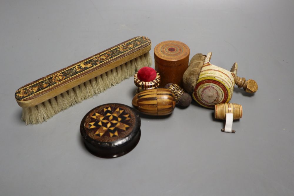 Four Tunbridgeware needlework accessories, a Tunbridgeware clothes brush, a miniature measure, a table clamp and a thread storage box,